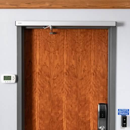 Dark Bronze Automatic Swing Door Operator by ASSA ABLOY - Sleek, Efficient, Reliable.