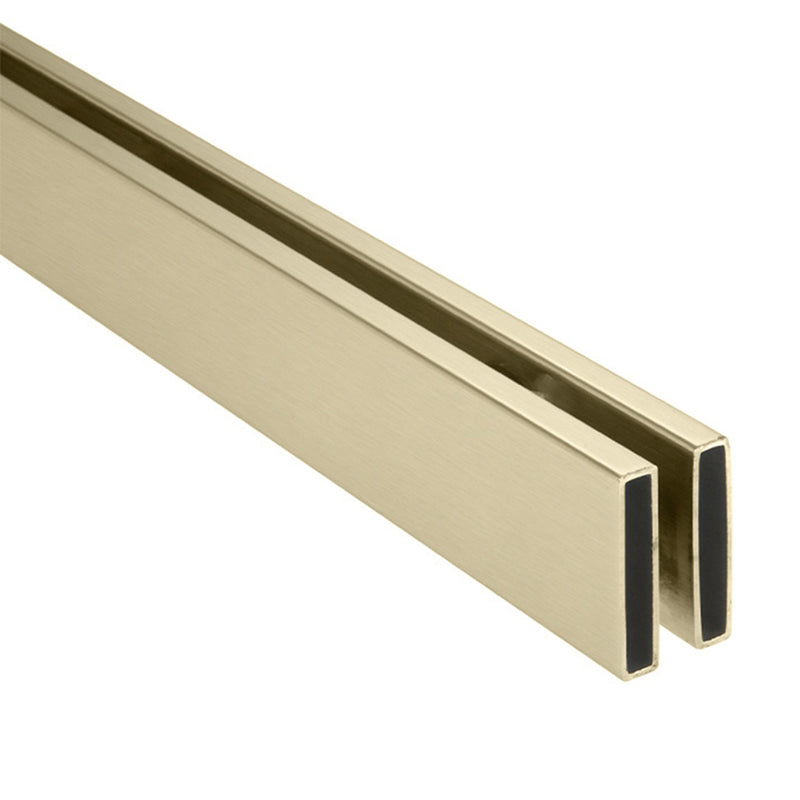 A close-up view of the brushed bronze stainless steel header bar for a Brixen sliding shower door system.