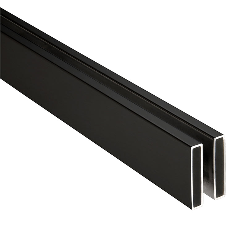 A close-up view of the matte black stainless steel header bar for the Brixen sliding shower door system.