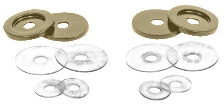 A set of brushed bronze brass washers and clear plastic gaskets for back-to-back pull handles.