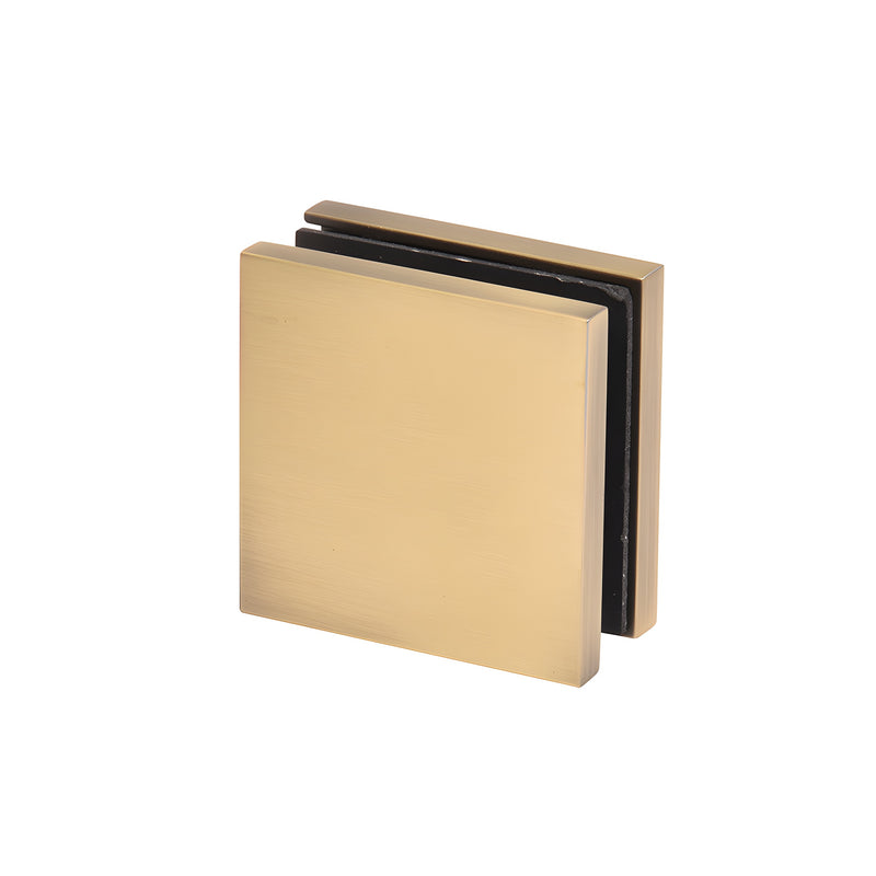 A square brushed bronze zero clamp for glass panels shown from a front angle.