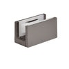 A brushed stainless anodized bottom guide for sliding door systems with a white plastic insert.