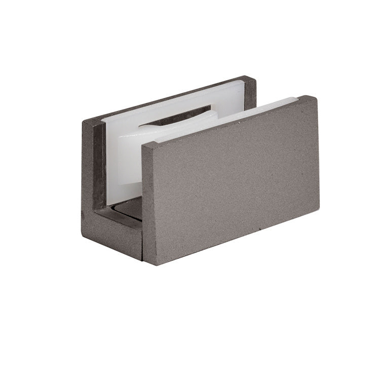 A brushed stainless anodized bottom guide for sliding door systems with a white plastic insert.