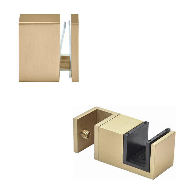 A brushed bronze 90-degree connector and a bottom door guide for the Cavoli sliding shower door system.
