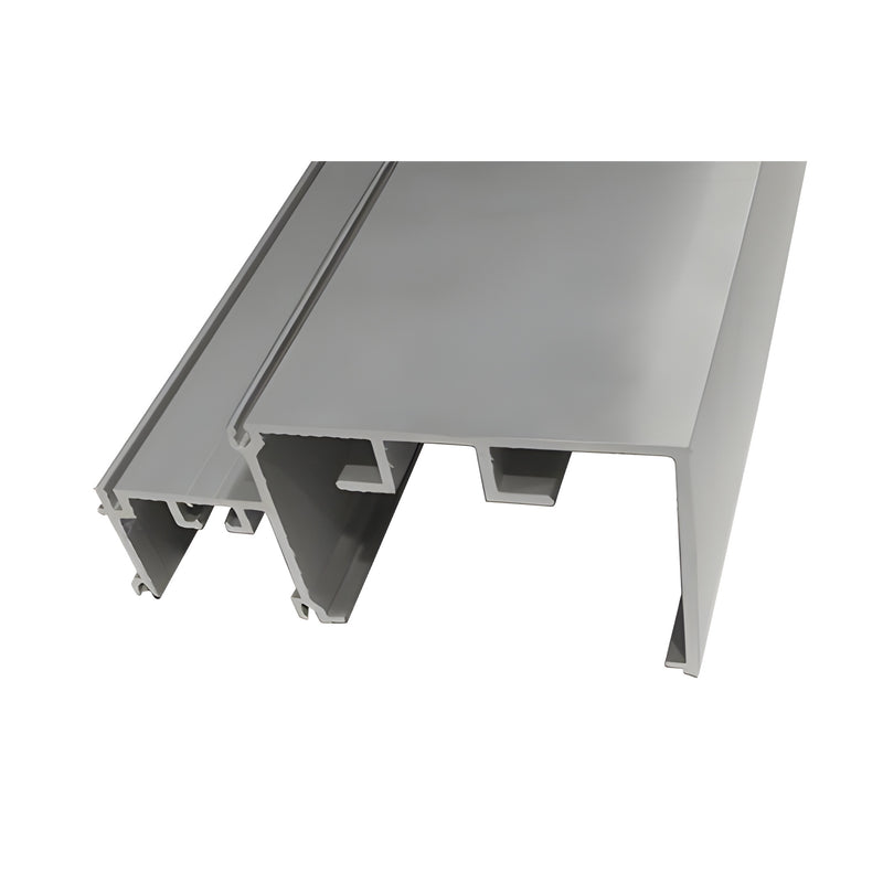 A close-up view of a clear anodized aluminum horizontal extrusion showing its structural profile.