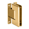 A French Gold wall mount H-back plate hinge for glass shower doors shown from an angled perspective.