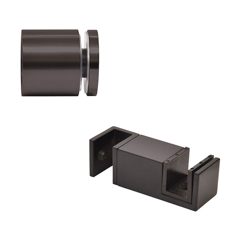 A matte black stainless steel 90-degree connector and a bottom guide for a Colonia sliding shower door system.