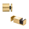 A satin brass 90-degree connector and a bottom guide for a Colonia sliding shower door system.
