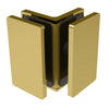 A satin brass Como Series glass-to-glass bracket shown in a corner configuration.