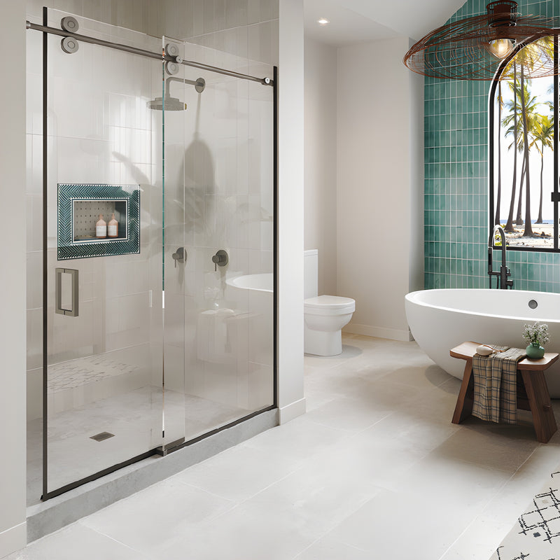 A modern bathroom featuring the CRL Crescent Series sliding glass shower door system in brushed stainless steel.