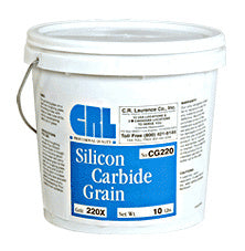 A white plastic bucket containing CRL 220X grit silicon carbide grain with a blue product label.