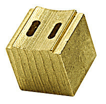 A close-up view of a solid brass tip nozzle with a 3/4 inch size and two rectangular openings on the top surface.