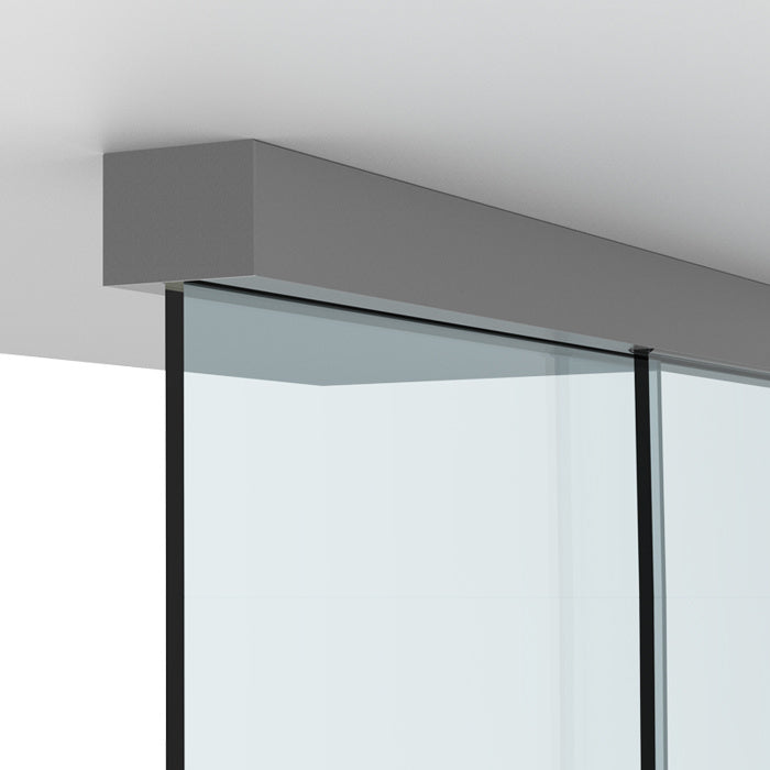 A close-up view of the satin anodized track and glass panel for the CRL 695 Series sliding door system.