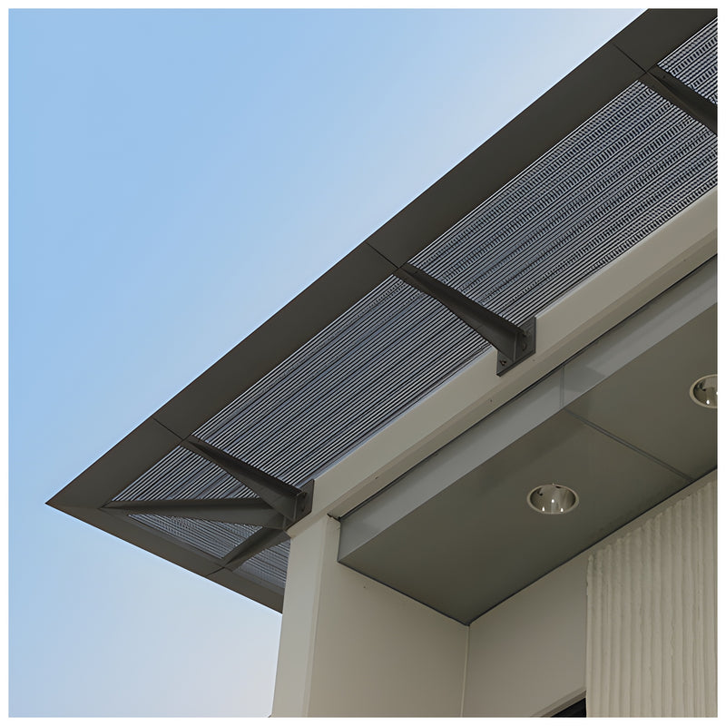 A low-angle view of a CRL Custom 7750 Series Sunshade featuring a perforated metal panel mounted to a building facade.