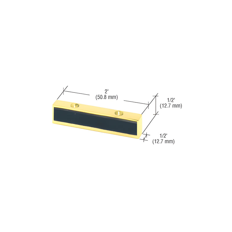 A polished brass header mounted single door stop with a black bumper insert and two mounting holes shown with dimension lines.