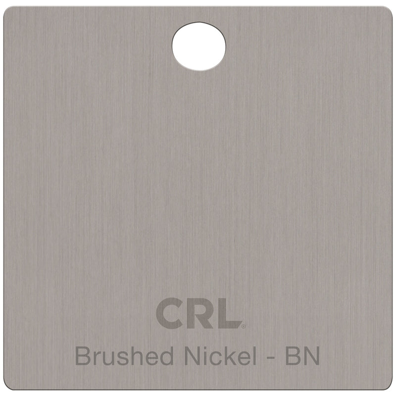 A square brass color chip with a brushed nickel finish and a hole at the top for mounting.