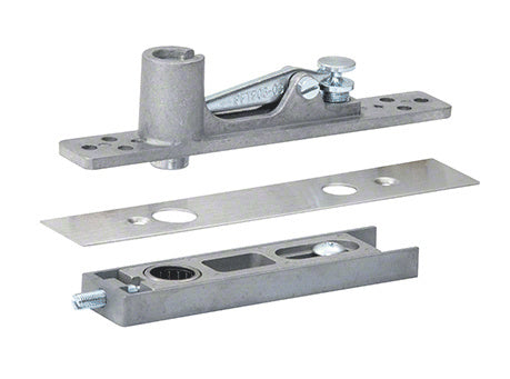 A center-hung top pivot set for aluminum storefront doors, shown with its brushed stainless steel cover plate and mounting components.