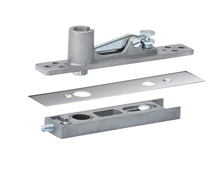 A center-hung top pivot set for aluminum storefront doors shown with its polished stainless steel cover and mounting components.
