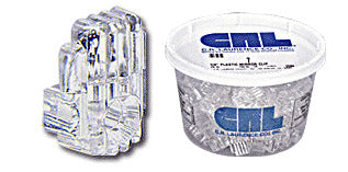 A close-up of a clear acrylic mirror clip next to a plastic container filled with multiple CRL 1/4 inch standard mirror clips.