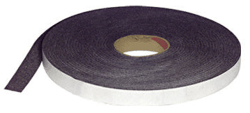 A continuous roll of brown cork and neoprene desk stripping shown from an angled perspective.