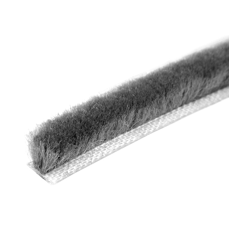 A close-up view of a gray pile weatherstrip showing the dense fibers and backing material.