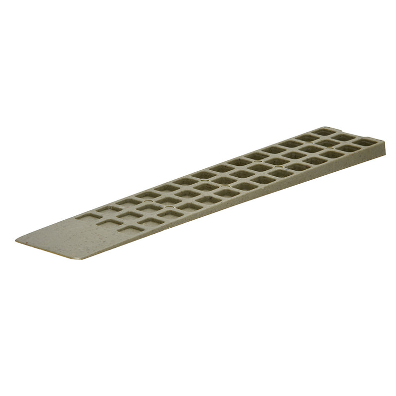 A single tapered plastic shim with a grid-patterned surface for leveling applications.