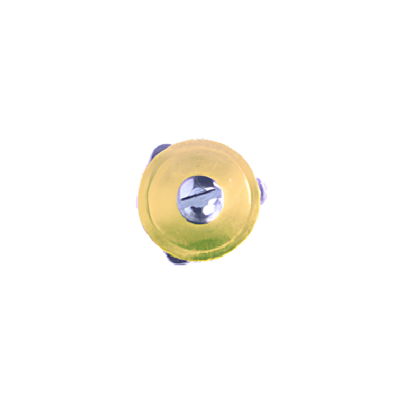 A top-down view of a circular gold-tone replacement cutting turret for a lens cutter.