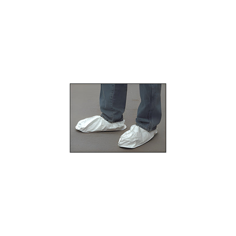 A person wearing white lightweight Tyvek shoe covers with PVC soles over their shoes.