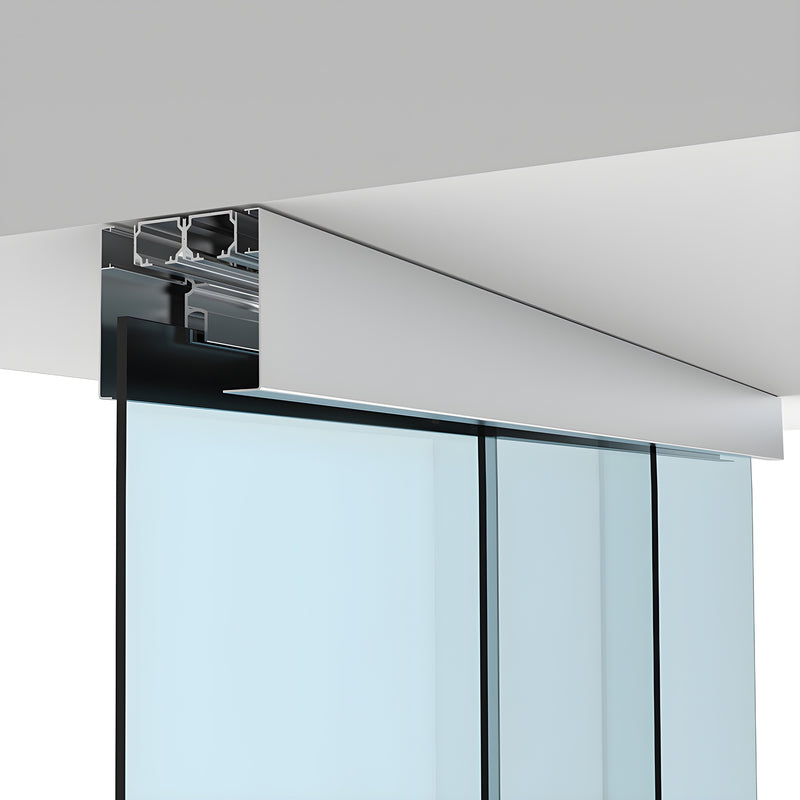 A close-up view of the satin anodized ceiling track system for a telescoping glass panel door.