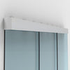 A close-up view of the satin anodized wall mount track system for a sliding glass door with fixed panels.