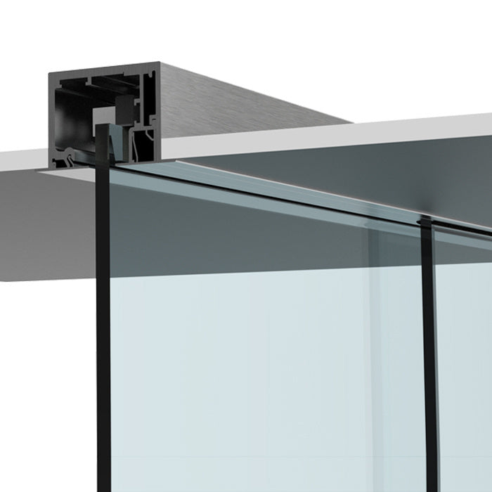 A close-up view of the brushed stainless anodized track system mounted in a drop ceiling with glass panels.
