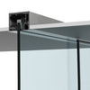 A close-up view of the brushed stainless anodized track system mounted into a drop ceiling with glass panels.