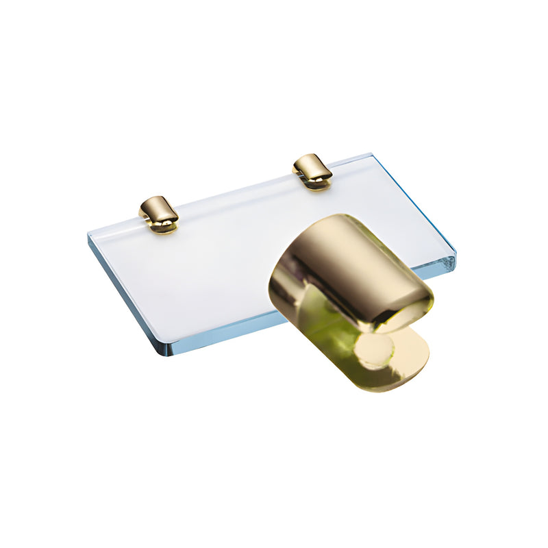A gold-plated round no-drill shelf clamp shown up close, with two identical clamps holding a glass shelf in the background.