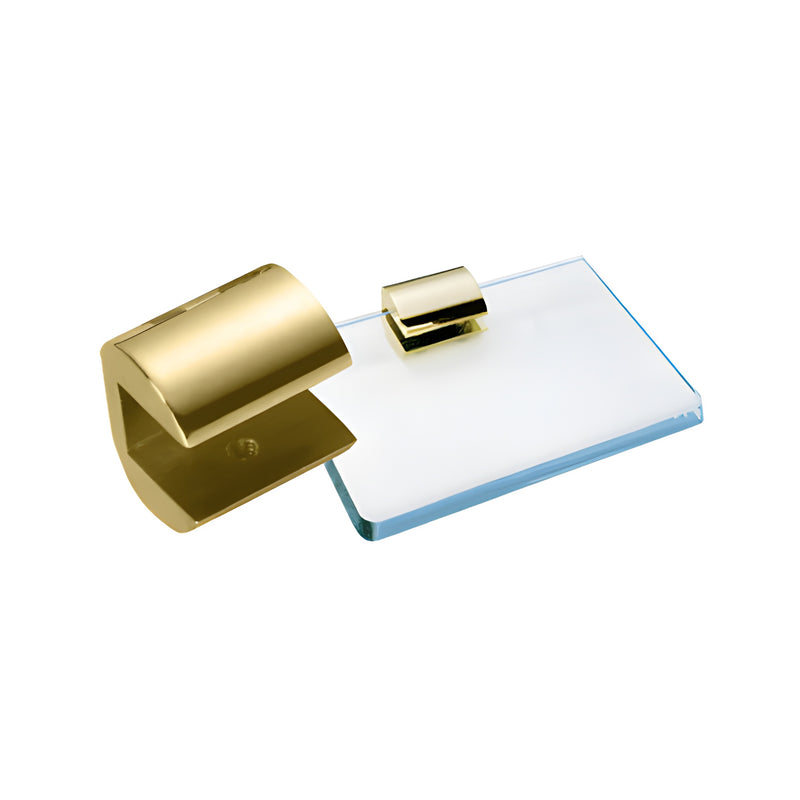 A gold-plated brass no-drill shelf clamp is shown next to a piece of 3/8-inch thick glass.