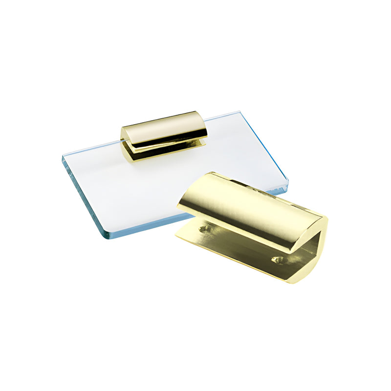 A gold plated brass no-drill shelf clamp shown both standalone and mounted on a 3/8 inch glass shelf.
