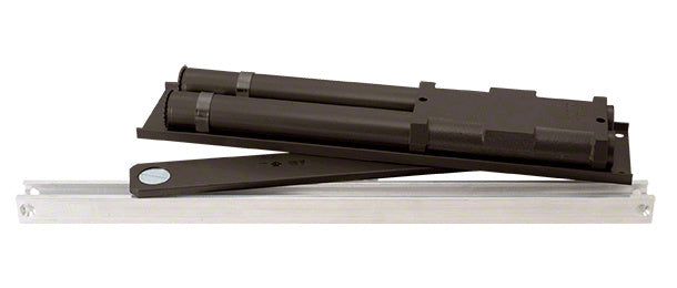The LCN overhead concealed door closer features a dark bronze body and a metal slide track for double-acting door applications.
