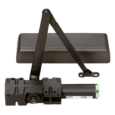 A dark bronze LCN surface-mounted door closer with an adjustable arm and protective cover.