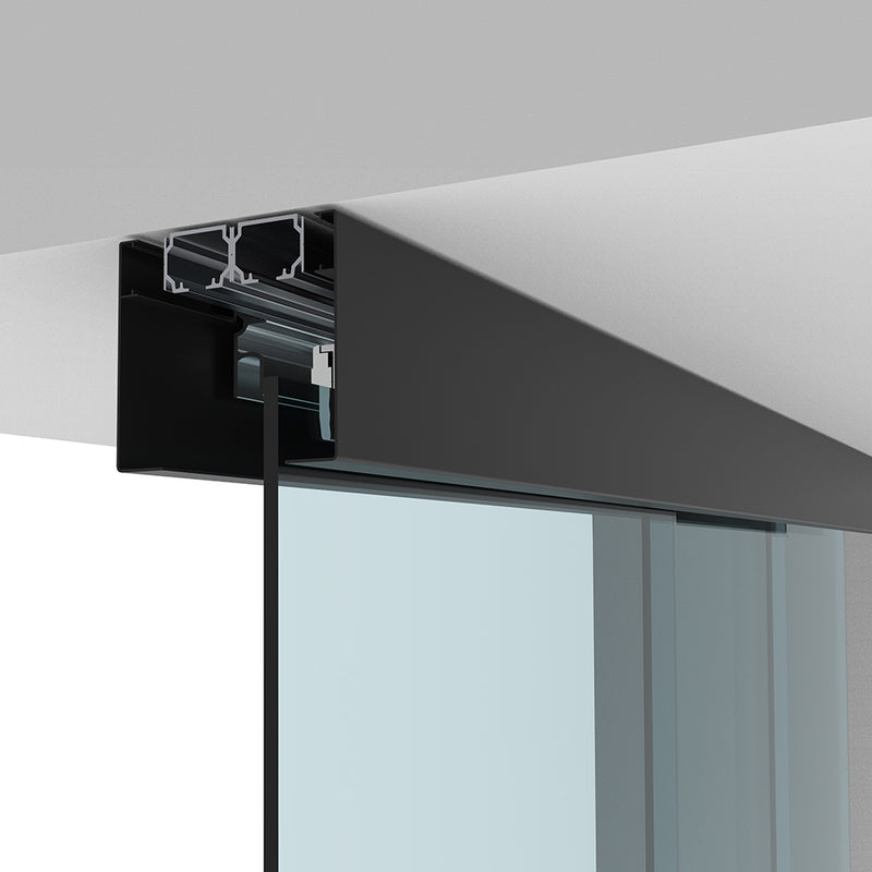 A close-up view of the matte black ceiling-mounted track system for a telescoping glass door.