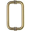 A front-facing view of the polished brass tubular back-to-back pull handle.