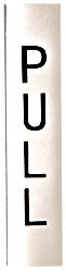 A vertical polished stainless steel pull indicator sign with the word PULL printed in black.