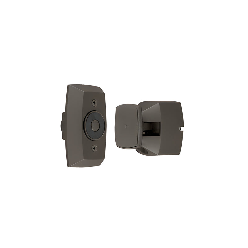 A Rixson electromagnetic door holder in a dark bronze finish shown with its magnetic lock component and matching door catch.