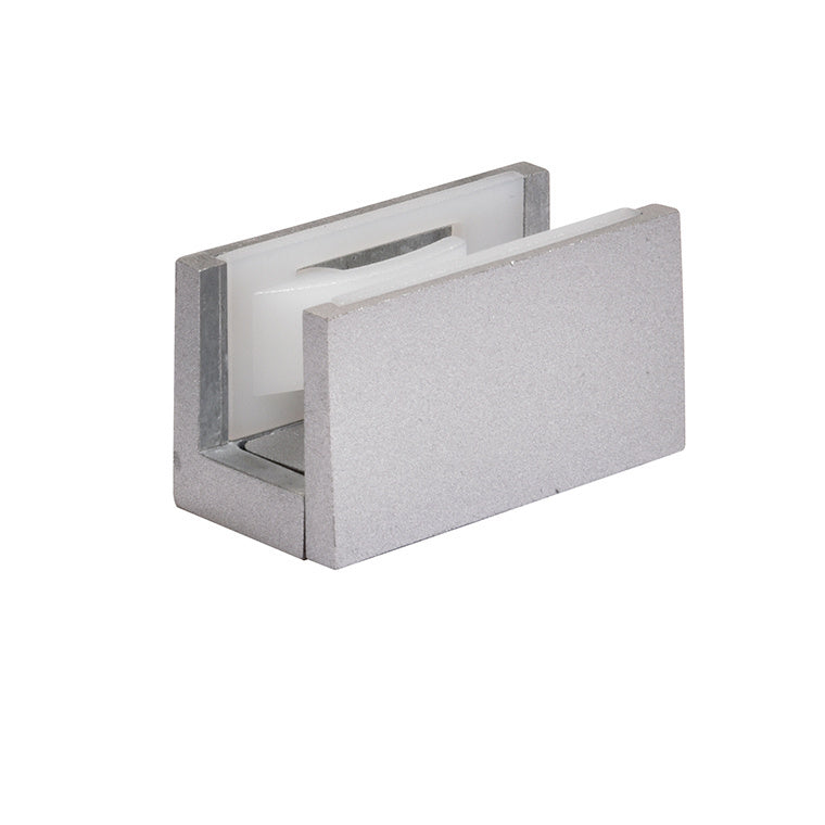 A satin anodized metal bottom guide for sliding door systems with a white plastic insert.
