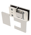 The Bellagio glass-to-glass hinge shown with its polished chrome cover plates partially removed to reveal the mounting hardware.