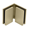 The interior view of the brass Bellagio Series glass-to-glass bracket showing the mounting plates.