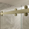 Close-up view of the top roller hardware on a brushed bronze Cambridge Series sliding shower door system.