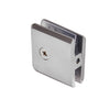 The rear view of the brushed chrome glass clamp showing the mounting screw and internal gaskets.
