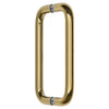 An angled view showing the squared design of the polished brass glass mount pull handle.