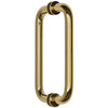 An angled view showing the tubular design and polished brass finish of the pull handle.