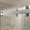 Close-up view of the top roller hardware and stainless steel track for the Cambridge Series sliding shower door system.