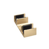 A detailed view of the brushed bronze floor guide component for the Brixen series sliding shower door system.